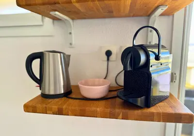 Cuisine ou kitchenette dans l'établissement Au Pied des Dunes avec Piscine