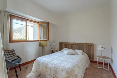 Un ou plusieurs lits dans un hébergement de l'établissement Villa Les Lys - Avec piscine et grand jardin