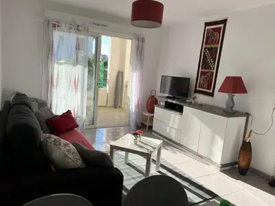 Télévision ou salle de divertissement dans l'établissement Appartement La Villa Gayrou