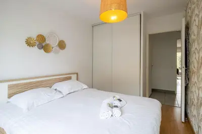 Un ou plusieurs lits dans un hébergement de l'établissement Appartement Exupéry - Welkeys