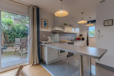 Cuisine ou kitchenette dans l'établissement La Terrasse