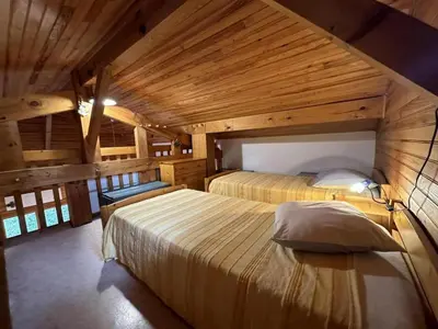 Un ou plusieurs lits dans un hébergement de l'établissement Chalet des dunes