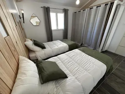 Un ou plusieurs lits dans un hébergement de l'établissement La maison poulet