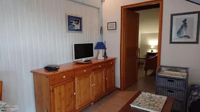 Télévision ou salle de divertissement dans l'établissement Marina