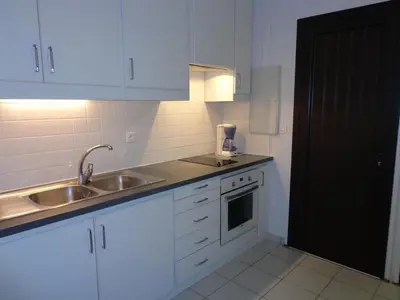 Cuisine ou kitchenette dans l'établissement Mimosas