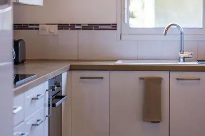 Cuisine ou kitchenette dans l'établissement Juine