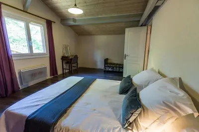 Un ou plusieurs lits dans un hébergement de l'établissement La grange du petit blay