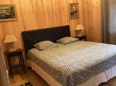 Un ou plusieurs lits dans un hébergement de l'établissement KBAIA le chalet océan
