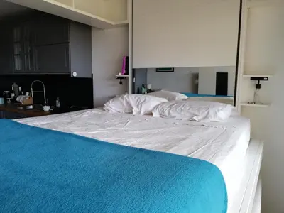 Un ou plusieurs lits dans un hébergement de l'établissement Studio cosy