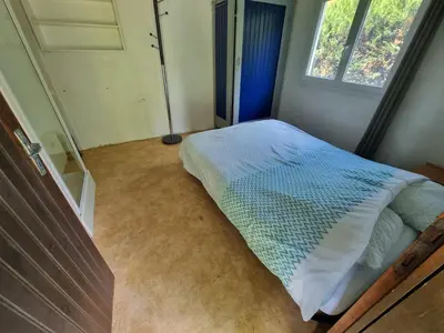 Un ou plusieurs lits dans un hébergement de l'établissement Maison vacances les fougères