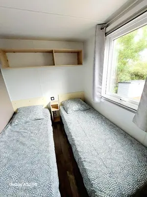 Un ou plusieurs lits dans un hébergement de l'établissement Mobil Home Denise et Michel