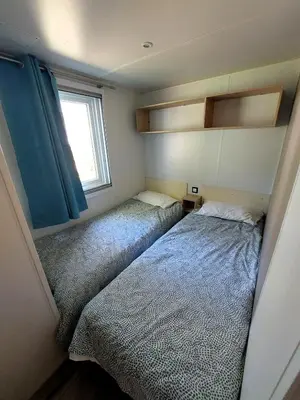 Un ou plusieurs lits dans un hébergement de l'établissement Mobil Home Denise et Michel