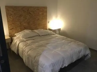 Un ou plusieurs lits dans un hébergement de l'établissement Maison rénovée au calme