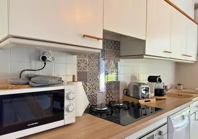 Cuisine ou kitchenette dans l'établissement Douce Évasion