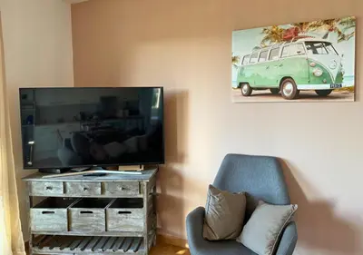 Télévision ou salle de divertissement dans l'établissement Douce Évasion