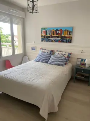 Un ou plusieurs lits dans un hébergement de l'établissement Charmant appartement de type 3 au deuxieme étage