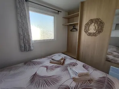 Un ou plusieurs lits dans un hébergement de l'établissement Mobile home à Mimizan géré par un particulier
