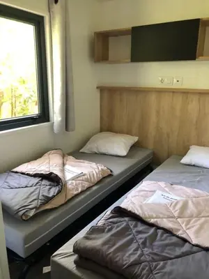Un ou plusieurs lits dans un hébergement de l'établissement Mobilhome Biscarrosse Camping Mayotte