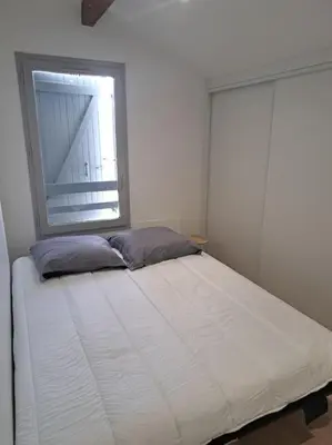 Un ou plusieurs lits dans un hébergement de l'établissement Maisonnette 2 chambres à deux pas des plages