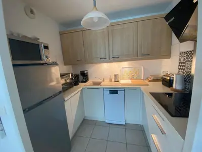 Cuisine ou kitchenette dans l'établissement Appartement de charme T3 avec petit jardin et parking