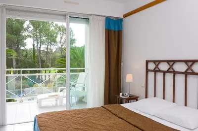 Un ou plusieurs lits dans un hébergement de l'établissement Madame Vacances Les Appartements de Moliets