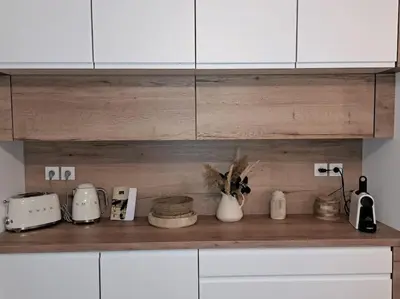 Cuisine ou kitchenette dans l'établissement Appartement cosy 2 chambres - 300m de la plage