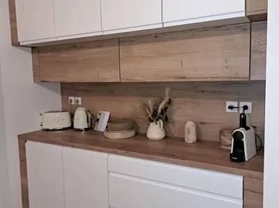 Cuisine ou kitchenette dans l'établissement Appartement cosy 2 chambres - 300m de la plage