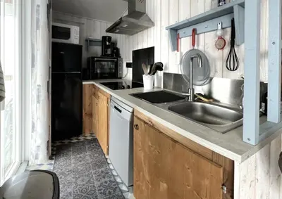 Cuisine ou kitchenette dans l'établissement Mobilhome tout confort