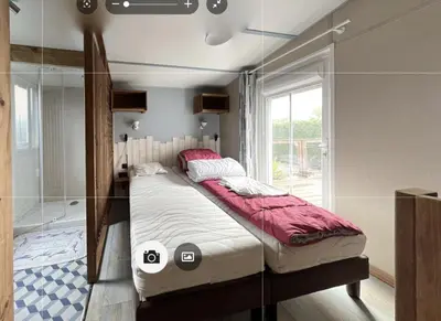 Un ou plusieurs lits dans un hébergement de l'établissement Mobilhome tout confort
