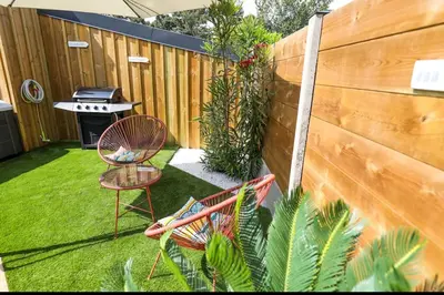 Jardin de l'établissement Appartement plage à pied