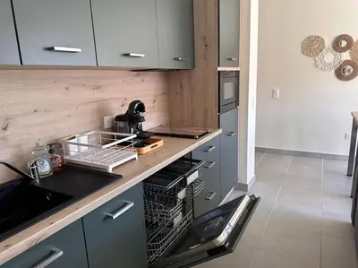 Cuisine ou kitchenette dans l'établissement A 600m de la plage - Le Nature -