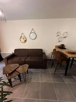 Coin salon dans l'établissement A 600m de la plage - Le Cosy -
