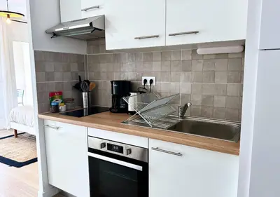 Cuisine ou kitchenette dans l'établissement Studio Biscawaï II