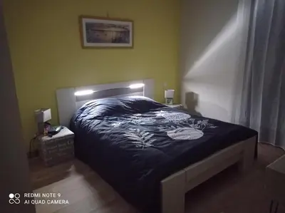 Un ou plusieurs lits dans un hébergement de l'établissement Maison cosy à côté de Biscarrosse