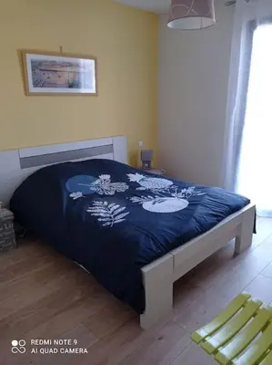 Un ou plusieurs lits dans un hébergement de l'établissement Maison cosy à côté de Biscarrosse