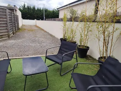 Jardin de l'établissement Maison chaleureuse au calme
