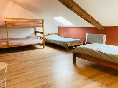 Un ou plusieurs lits dans un hébergement de l'établissement Gîte 10 personnes dans la Nature proche Océan Landes