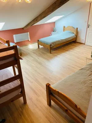 Un ou plusieurs lits dans un hébergement de l'établissement Gîte 10 personnes dans la Nature proche Océan Landes