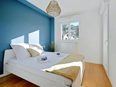 Un ou plusieurs lits dans un hébergement de l'établissement Nahia premium apartment with parking, by Hossegor Lake & ocean