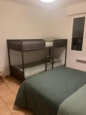 Un ou plusieurs lits dans un hébergement de l'établissement Maison Mimizan plage
