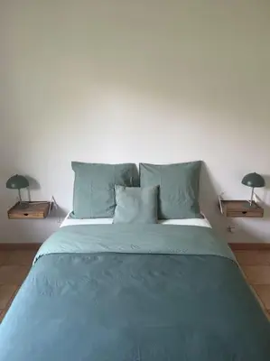 Un ou plusieurs lits dans un hébergement de l'établissement Maison Mimizan plage
