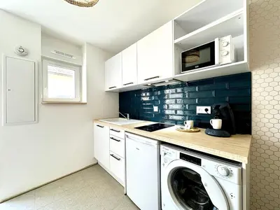 Cuisine ou kitchenette dans l'établissement L'Échappée - Clim - Fibre - Parking - Neuf