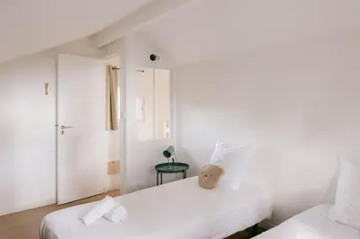 Un ou plusieurs lits dans un hébergement de l'établissement Slow Village Biscarrosse Lac