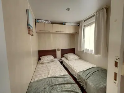 Un ou plusieurs lits dans un hébergement de l'établissement Mobilhome Cocooning