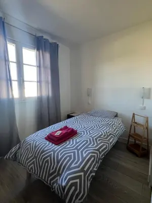 Un ou plusieurs lits dans un hébergement de l'établissement Hôtel Restaurant La Tonnelle