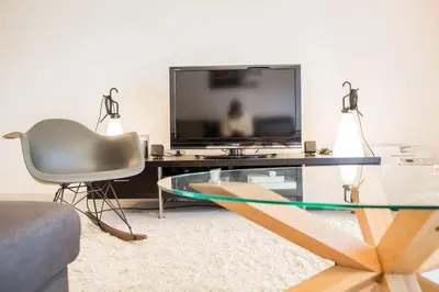 Télévision ou salle de divertissement dans l'établissement Belle villa-patio à 700m de l'océan