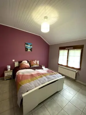 Un ou plusieurs lits dans un hébergement de l'établissement La maison du Haou