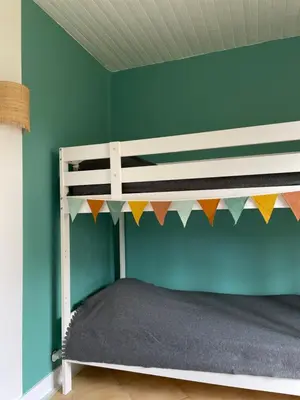 Un ou plusieurs lits dans un hébergement de l'établissement Chalet entre océan et foret au calme
