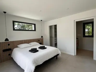 Un ou plusieurs lits dans un hébergement de l'établissement Villas-des-oyats - Ophila - 8 personnes climatisée piscine chauffée