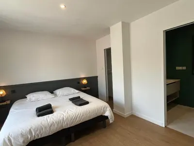 Un ou plusieurs lits dans un hébergement de l'établissement Villas-des-oyats - Ophila - 8 personnes climatisée piscine chauffée